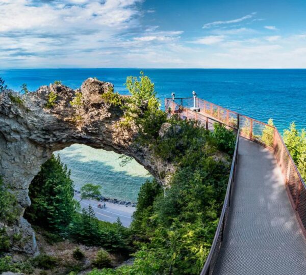 Aerial view of Mackinac Island, Michigan surrounded by turquoise waters of Lake Huron