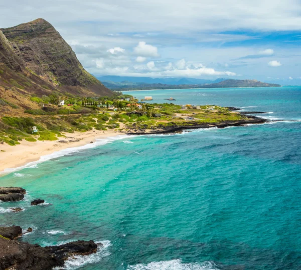 Scenic view of Kaupoa Beach with turquoise waters and palm trees